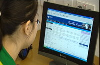 A student looking at a computer screen