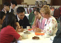 A group of international students talking with an advisor