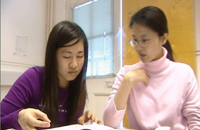 Two students looking at an assignment