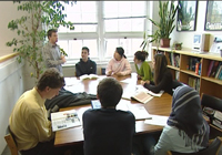 A small group of students learning with a tutor